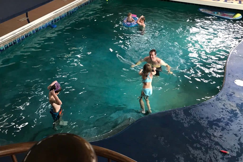 Indoor pool that converts to a basketball court in the summer at Mansion on the Lake in Newton, WI