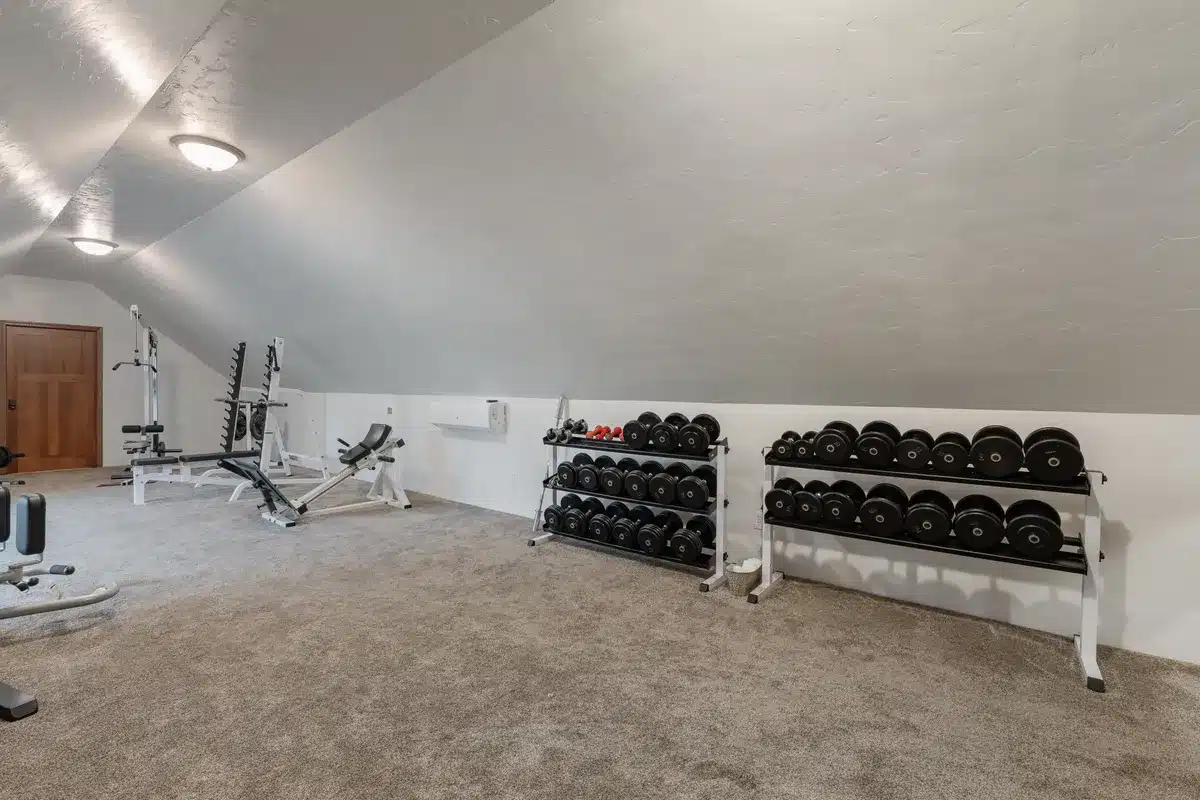 Workout room at Mansion on the Lake featuring a full set of free weights, dumbbells, and weight racks